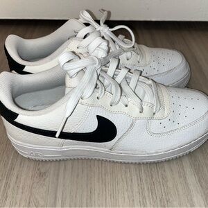 Nike Kids White Sneakers with Black Swoosh